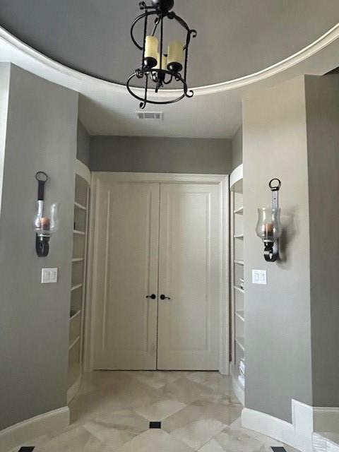 1900 Durance Ct, Corinth, TX 76210 - foyer with visible vents, a chandelier, and baseboards