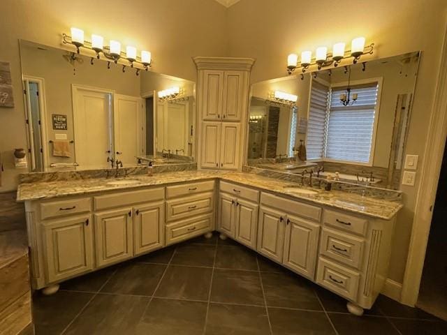 1900 Durance Ct, Corinth, TX 76210 - bathroom featuring double vanity, tile patterned flooring, and a sink