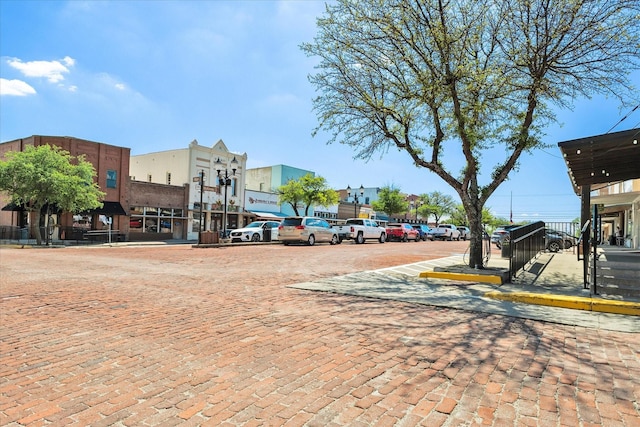view of road with sidewalks and street lighting