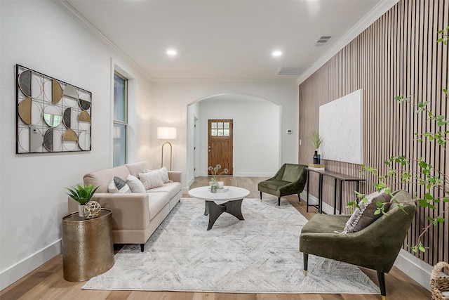 5105 Birchman Ave, Fort Worth, TX 76107 - living room with crown molding, arched walkways, visible vents, and baseboards