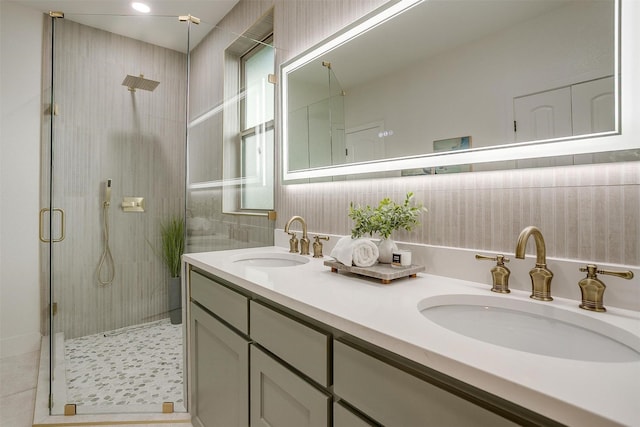 5105 Birchman Ave, Fort Worth, TX 76107 - bathroom with tile patterned flooring, a stall shower, double vanity, and a sink