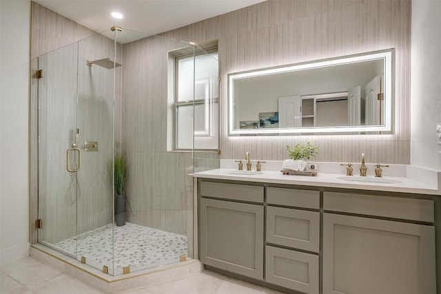 5105 Birchman Ave, Fort Worth, TX 76107 - bathroom featuring a stall shower, double vanity, and a sink