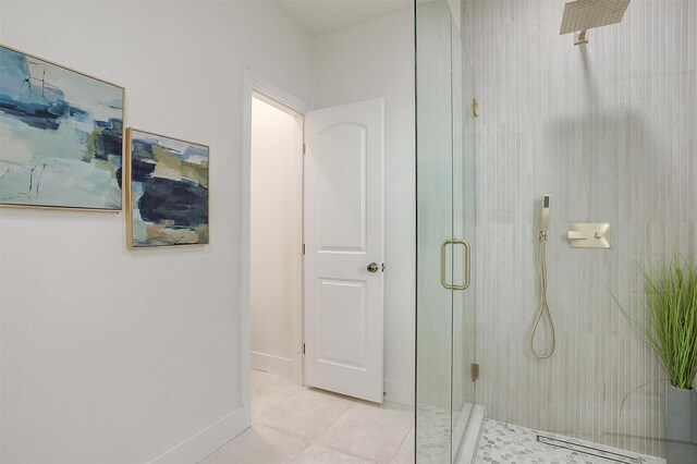 5105 Birchman Ave, Fort Worth, TX 76107 - bathroom featuring a shower with shower door, tile patterned flooring, and baseboards