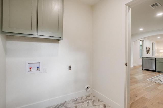 5105 Birchman Ave, Fort Worth, TX 76107 - laundry room with hookup for an electric dryer, washer hookup, baseboards, and arched walkways