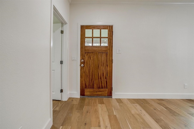 5105 Birchman Ave, Fort Worth, TX 76107 - foyer entrance featuring baseboards, light wood-type flooring, and crown molding