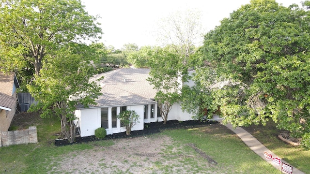 2509 Skiles Dr, Plano, TX 75075 - exterior space featuring a front yard and a shingled roof