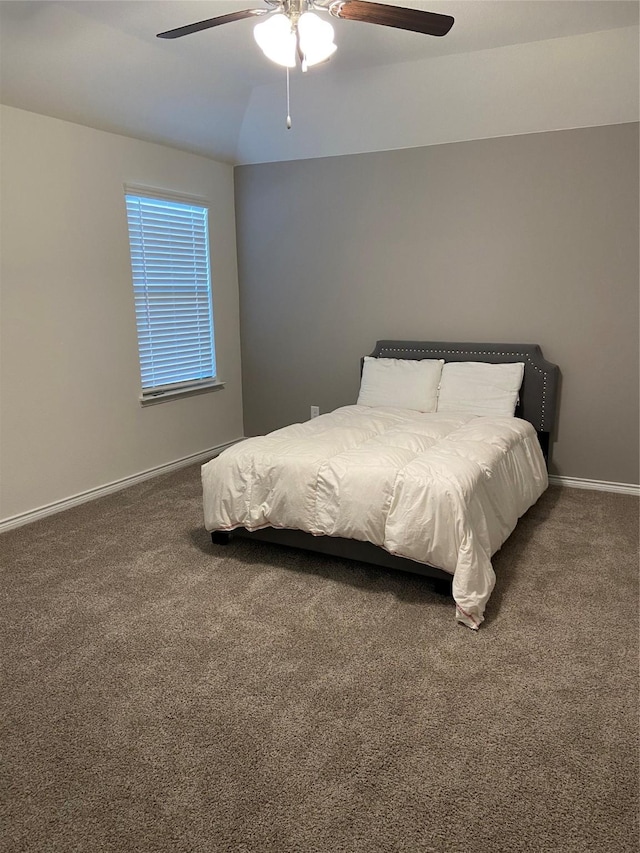 carpeted bedroom with baseboards and ceiling fan