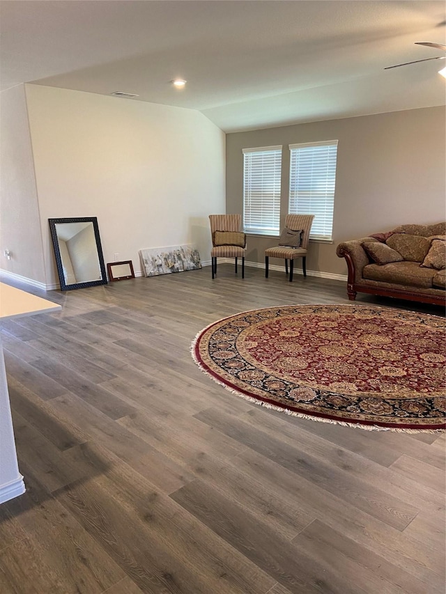 sitting room with baseboards and wood finished floors