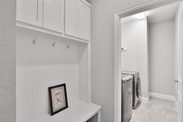 925 Spring Falls Dr, Mckinney, TX 75071 - laundry area with washing machine and dryer, cabinet space, and baseboards