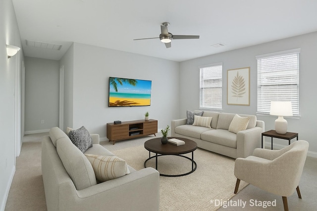 925 Spring Falls Dr, Mckinney, TX 75071 - living area featuring light colored carpet, baseboards, and a ceiling fan