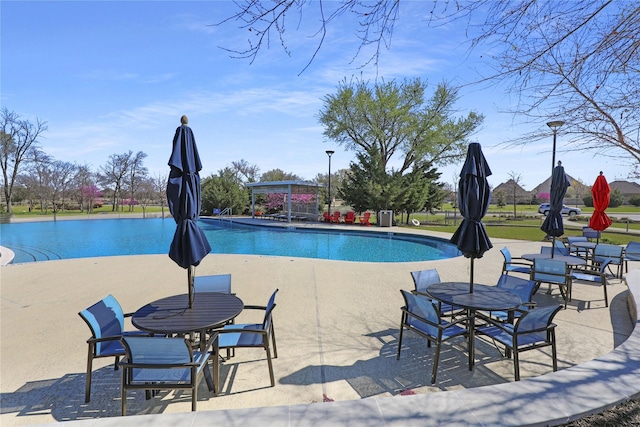 community pool with a patio