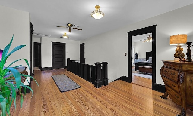 entrance foyer with ceiling fan and light wood-style floors