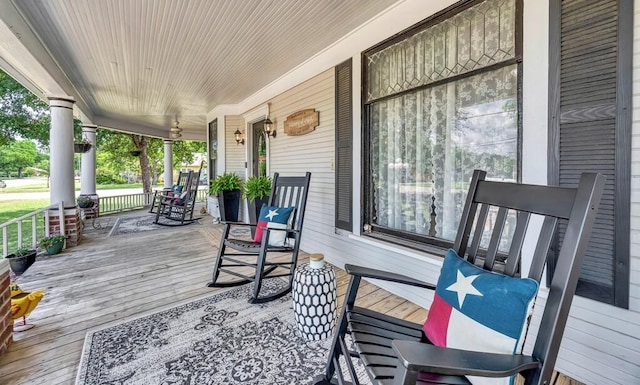 wooden terrace featuring covered porch