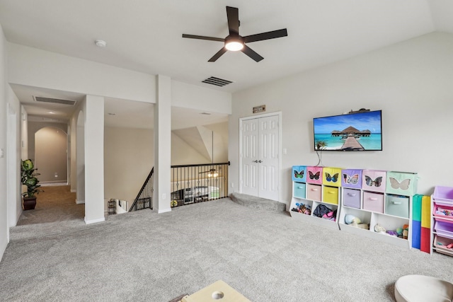 rec room with a ceiling fan, visible vents, carpet floors, and arched walkways