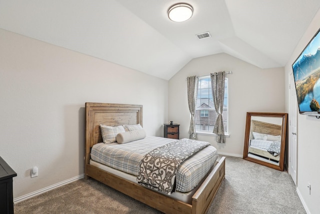 bedroom featuring carpet flooring, visible vents, lofted ceiling, and baseboards