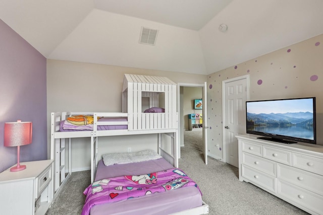 bedroom featuring visible vents, light carpet, and vaulted ceiling