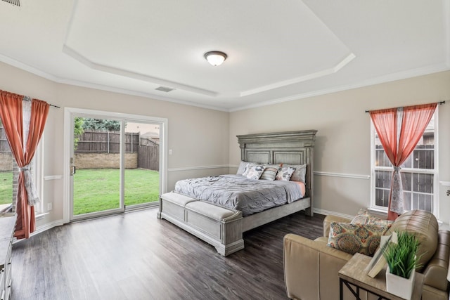bedroom with visible vents, a tray ceiling, ornamental molding, wood finished floors, and access to outside