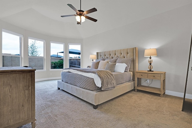 carpeted bedroom featuring baseboards, a ceiling fan, and vaulted ceiling