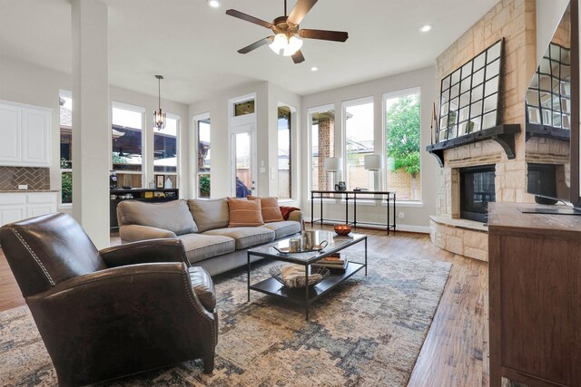 dining room featuring arched walkways, baseboards, an inviting chandelier, and dark wood finished floors