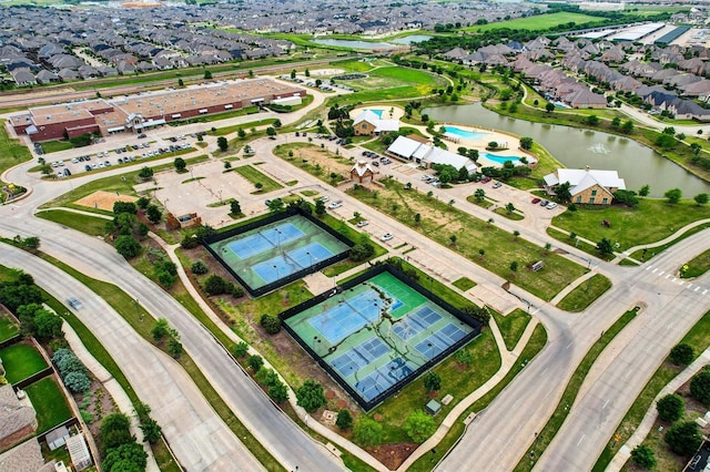 birds eye view of property with a water view and a residential view