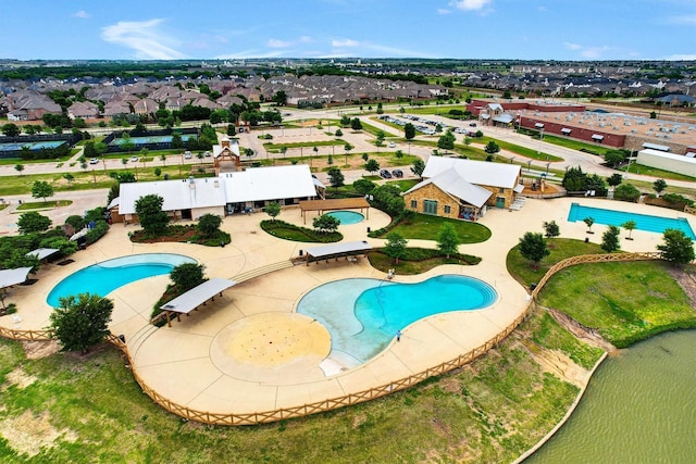 birds eye view of property featuring a water view
