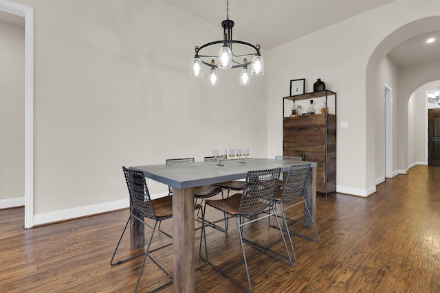 3555 Fieldview Ct, Celina, TX 75009 - dining space with arched walkways, a chandelier, and dark wood-style flooring