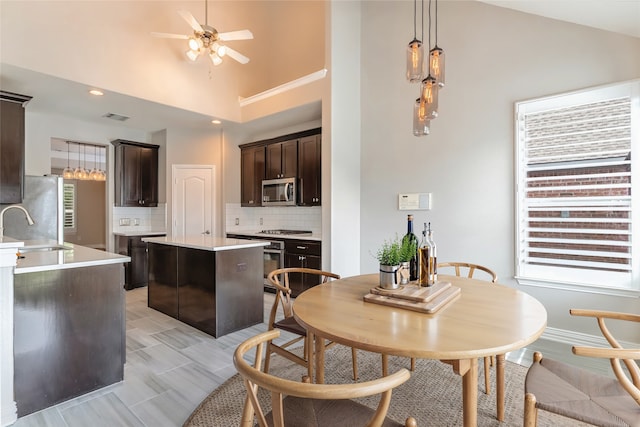 7955 Rasor Dr, Frisco, TX 75036 - dining space with healthy amount of natural light, ceiling fan, and lofted ceiling