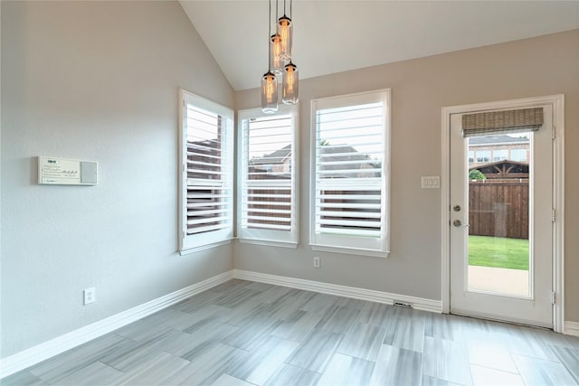 7955 Rasor Dr, Frisco, TX 75036 - unfurnished dining area with baseboards and lofted ceiling