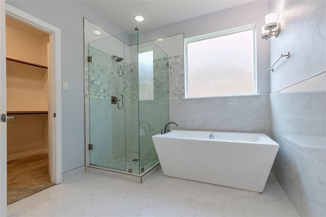 7955 Rasor Dr, Frisco, TX 75036 - full bathroom with a stall shower, a walk in closet, a freestanding bath, and marble finish floors