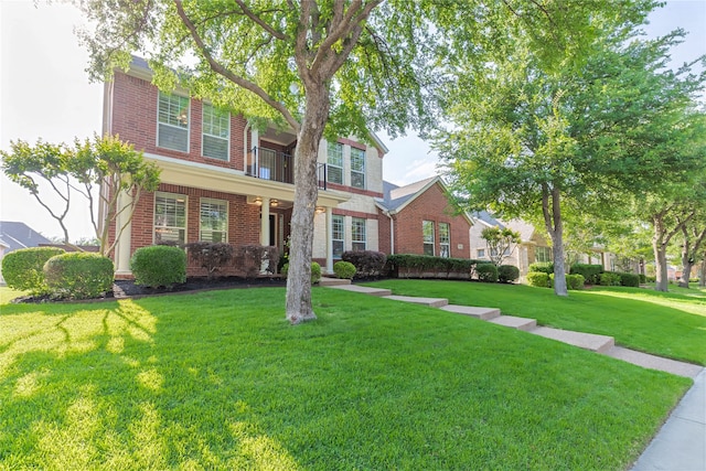 7955 Rasor Dr, Frisco, TX 75036 - traditional-style home featuring brick siding and a front yard