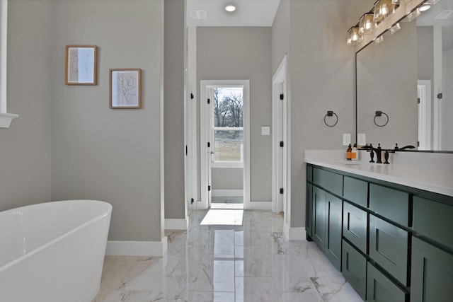 108 Grace View Rd, Weatherford, TX 76088 - bathroom with a freestanding tub, vanity, marble finish floor, and baseboards