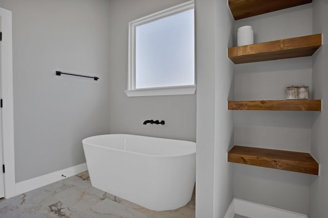 108 Grace View Rd, Weatherford, TX 76088 - full bath with marble finish floor, a freestanding tub, and baseboards