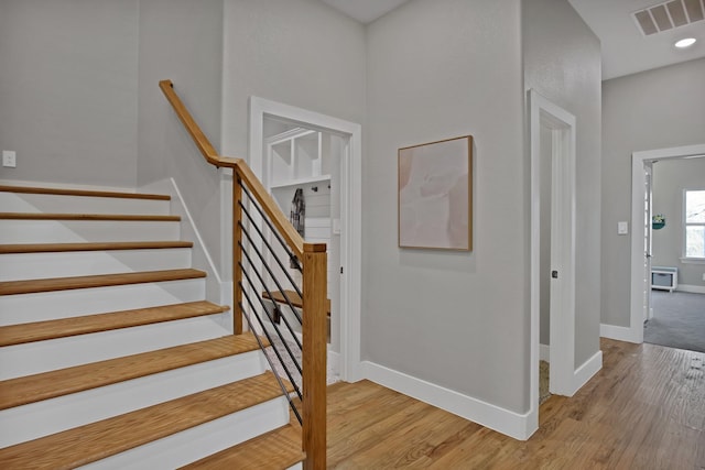 108 Grace View Rd, Weatherford, TX 76088 - stairs featuring wood finished floors, visible vents, and baseboards