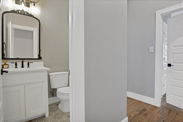 108 Grace View Rd, Weatherford, TX 76088 - bathroom with toilet, wood finished floors, vanity, and baseboards