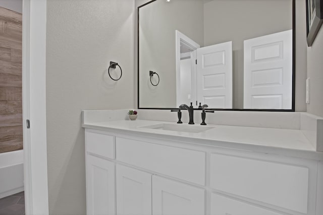 108 Grace View Rd, Weatherford, TX 76088 - full bathroom featuring a textured wall, vanity, and a bath