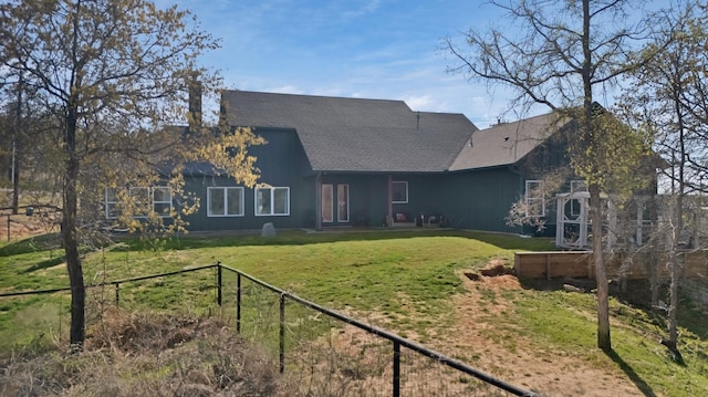 108 Grace View Rd, Weatherford, TX 76088 - rear view of property featuring fence, a shingled roof, and a yard
