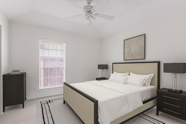 bedroom featuring a ceiling fan, light colored carpet, and baseboards