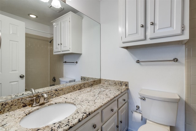 full bath featuring toilet and vanity