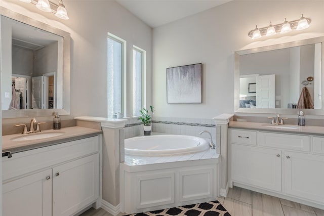 14733 Cedar Flat Way, Fort Worth, TX 76262 - bathroom with a garden tub, two vanities, and a sink