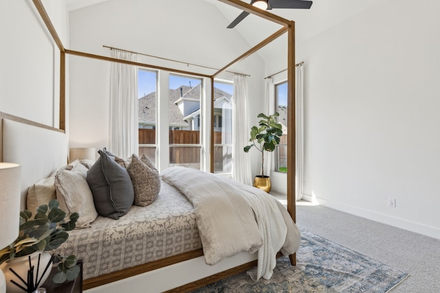 bedroom featuring ceiling fan, carpet floors, lofted ceiling, and multiple windows