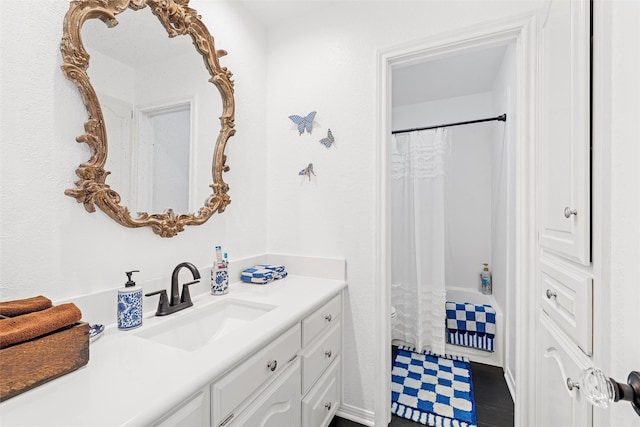 full bath with vanity and a shower with curtain