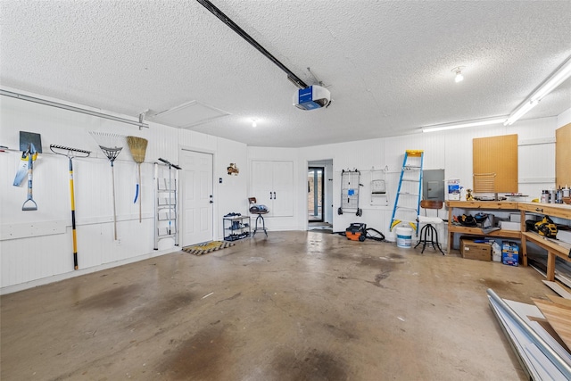garage featuring a garage door opener and electric panel