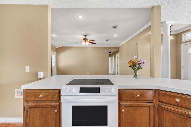kitchen featuring ornamental molding, white electric stove, and light countertops