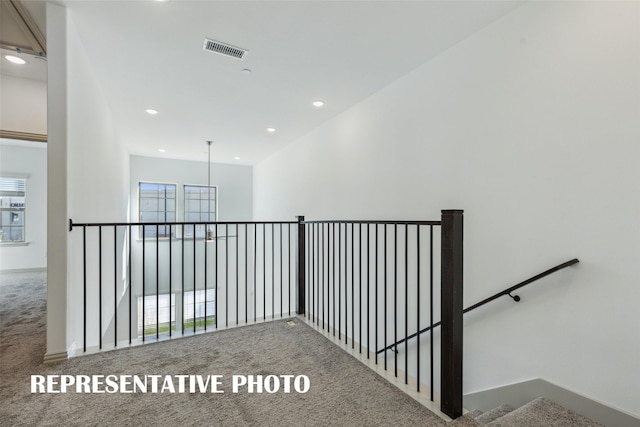 stairway with visible vents, recessed lighting, carpet flooring, and plenty of natural light
