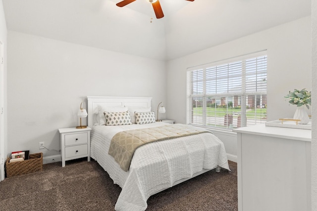 bedroom with baseboards, ceiling fan, lofted ceiling, and dark colored carpet