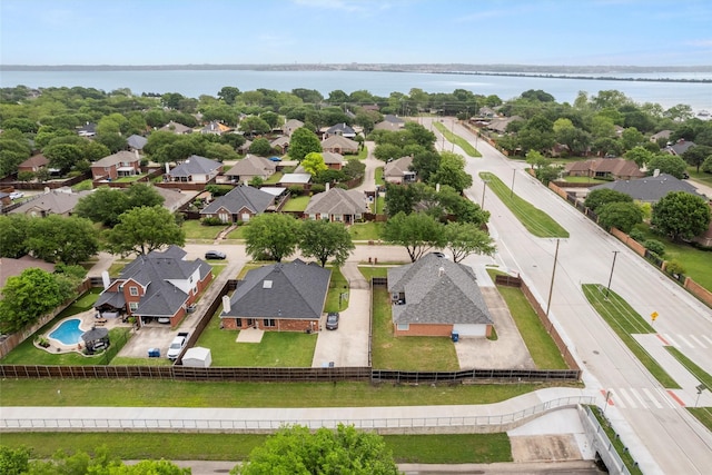 drone / aerial view with a residential view and a water view