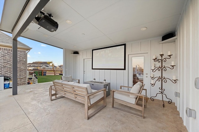 home theater room with concrete flooring