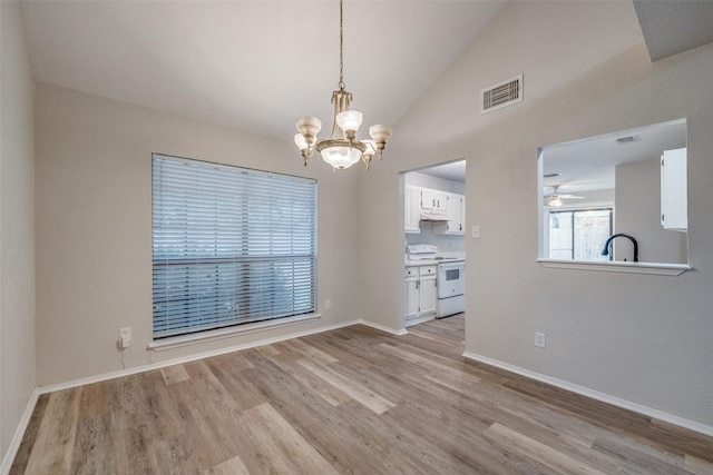 2406 Sutton Dr, Arlington, TX 76018 - unfurnished dining area featuring visible vents, lofted ceiling, and light wood-type flooring