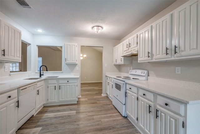 2406 Sutton Dr, Arlington, TX 76018 - kitchen with white cabinets, under cabinet range hood, white appliances, and visible vents