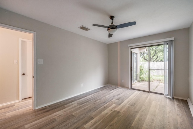 2406 Sutton Dr, Arlington, TX 76018 - empty room featuring a ceiling fan, baseboards, visible vents, and wood finished floors